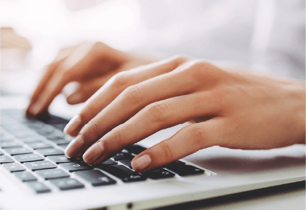 Typing on laptop
